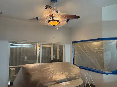 Plastic containment protecting a room during a North Port water damage dry-out